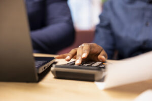 man woman reviewing bills financial documents track expenses